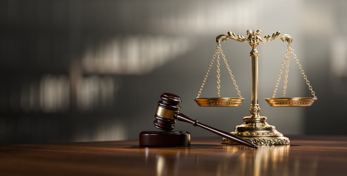 Scales of justice and gavel on a desk