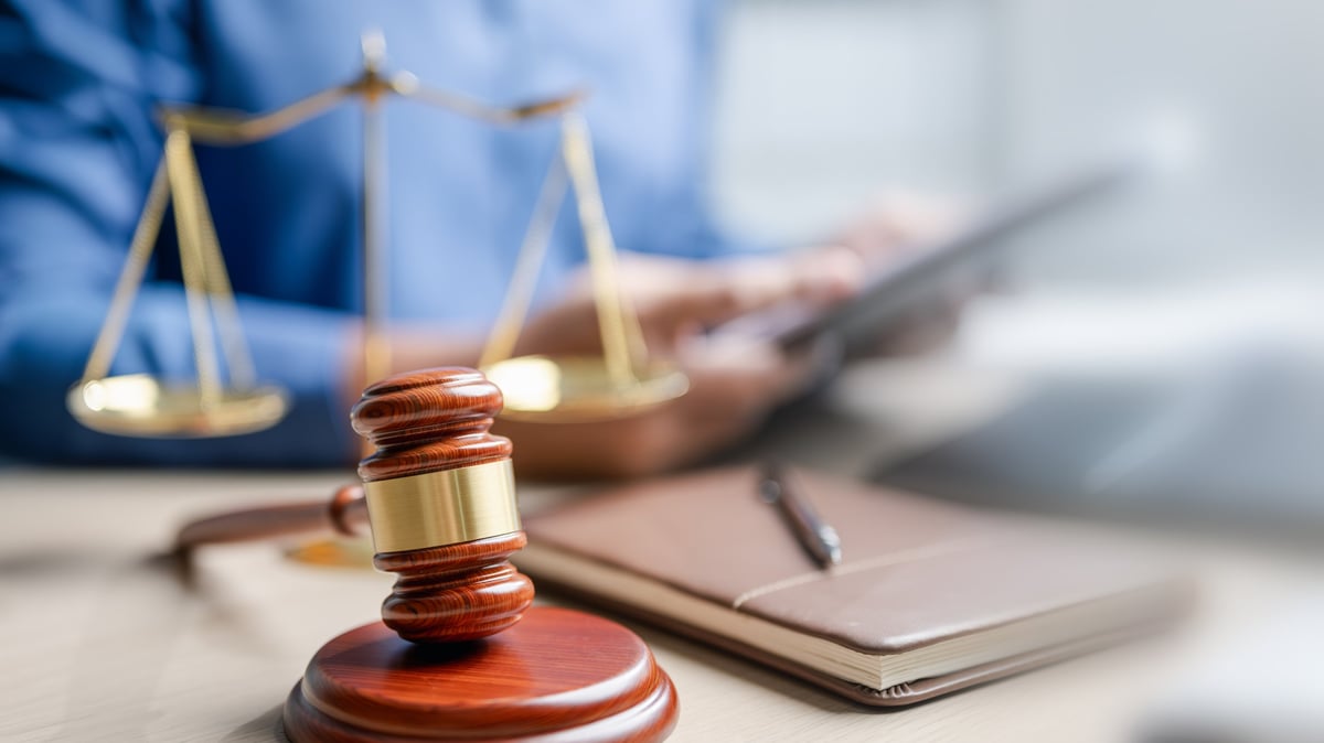 Law books and gavel — knowledge is your best defense