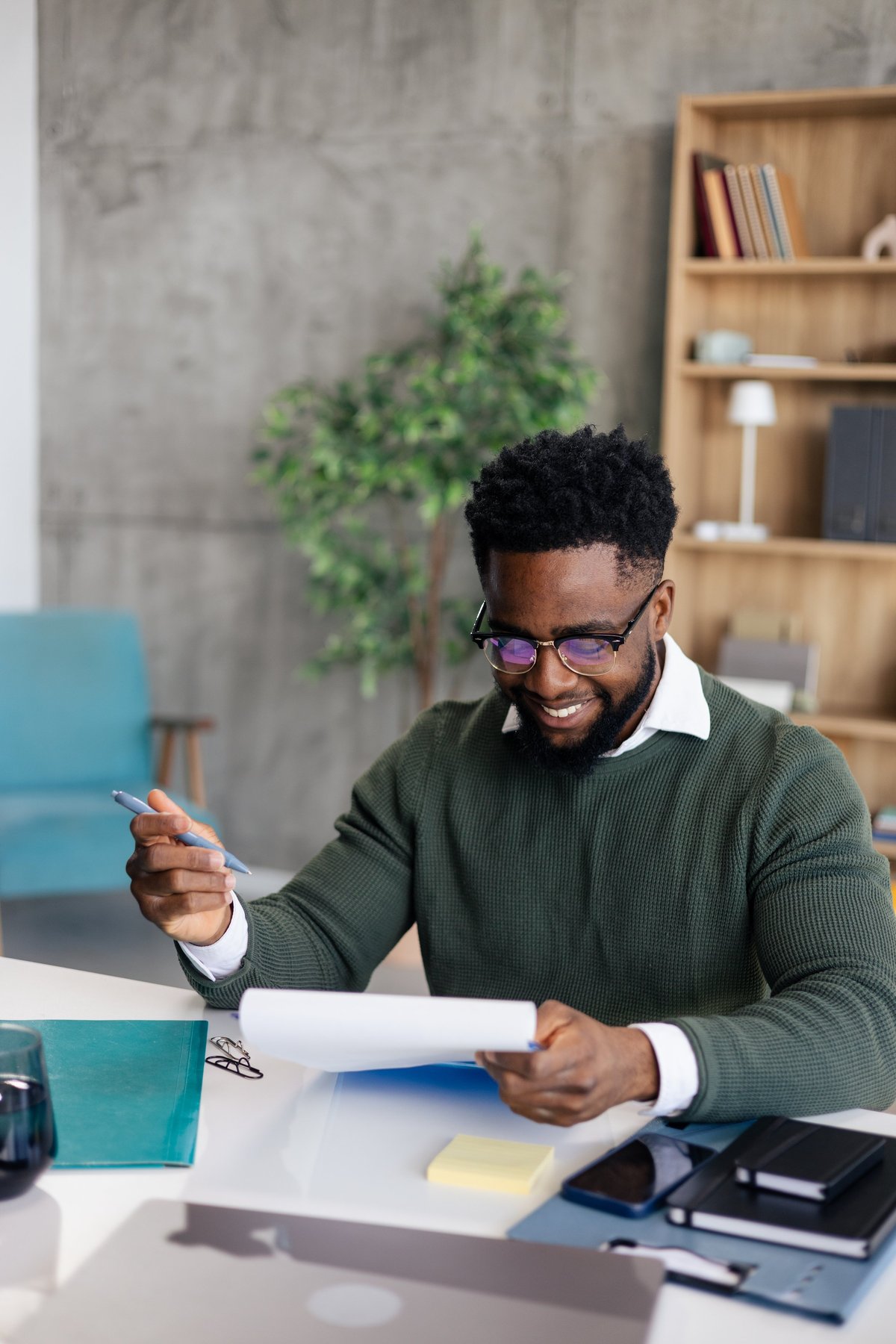 Professional reviewing legal documents and homeowner resources at a modern desk
